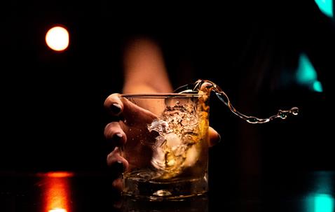 woman spills alcoholic drink