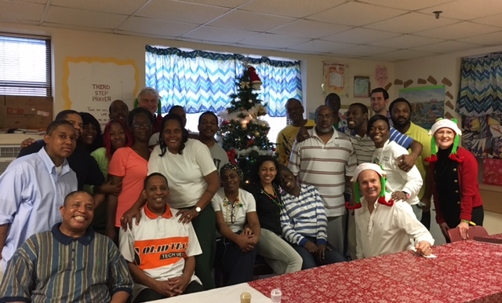 Large group smiles at the camera