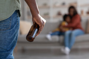 Man Holding Alcohol Bottle